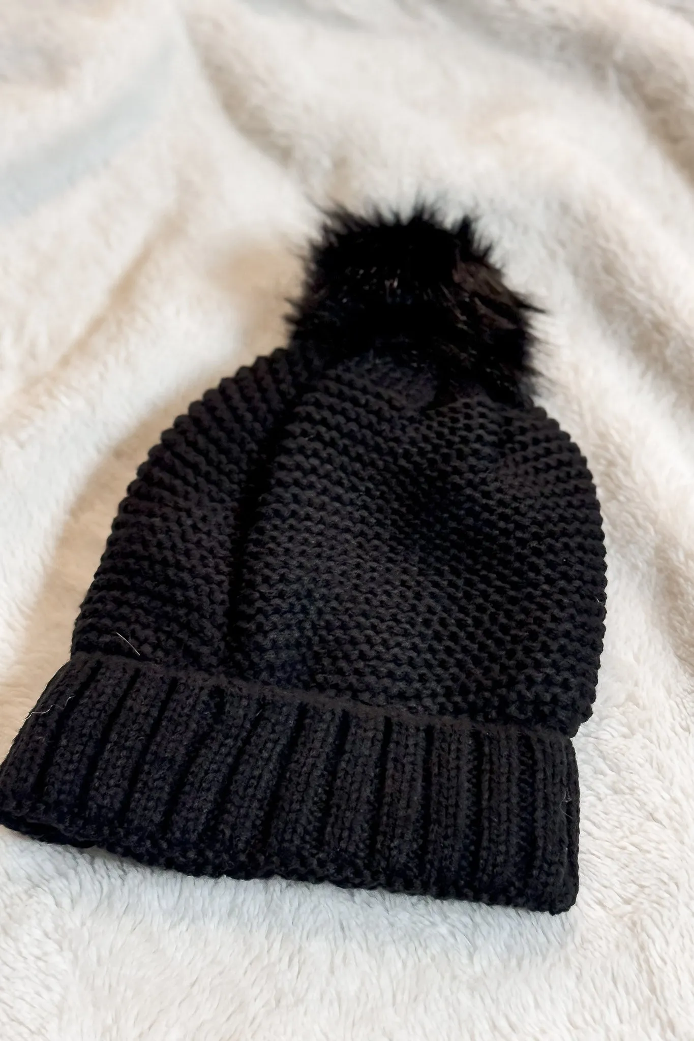 Pom Beanie in Black with Faux Sherpa Lining